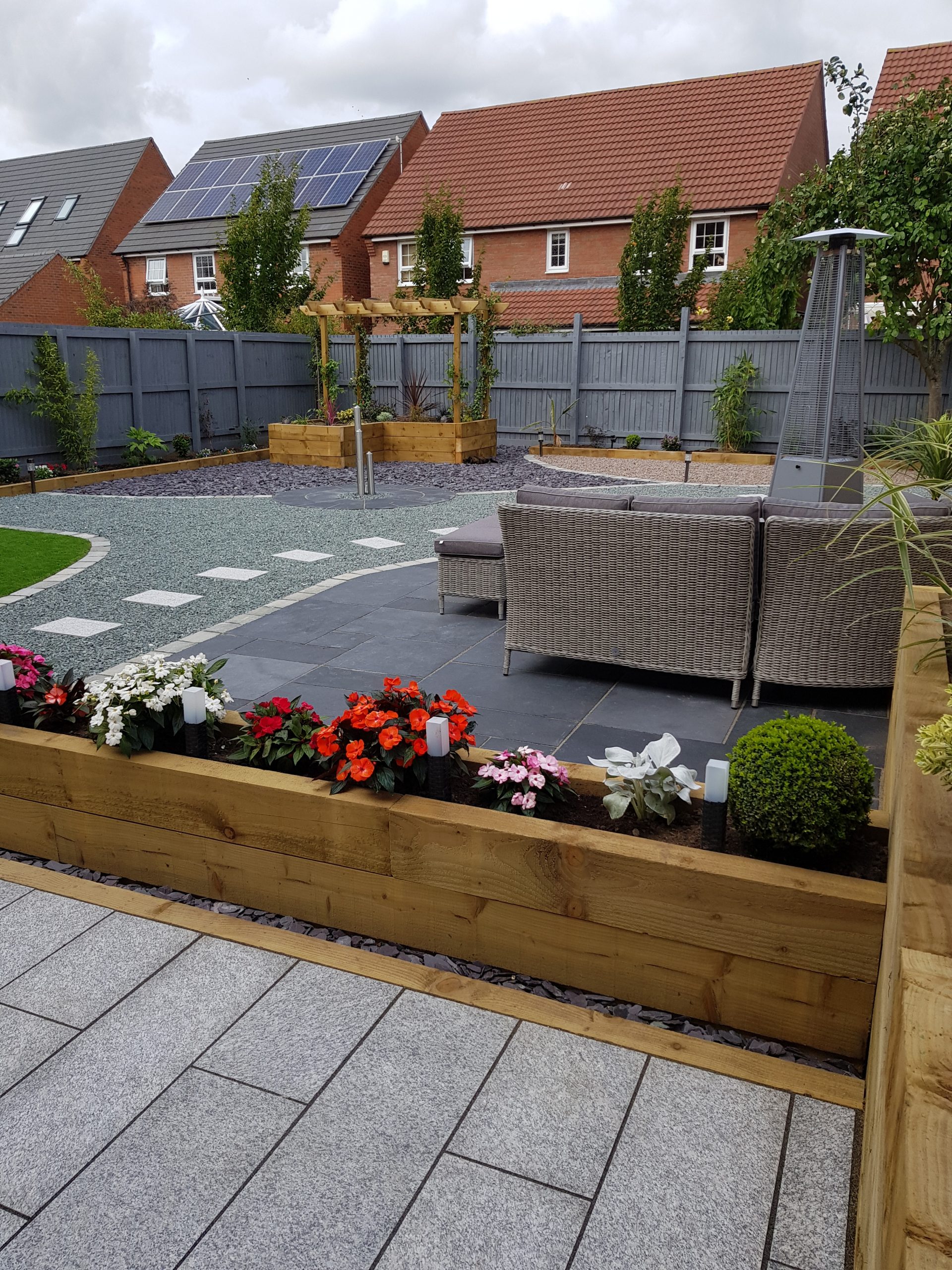 Garden transformation Newark, grey and plum slate, patio, raised wooden sleeper borders