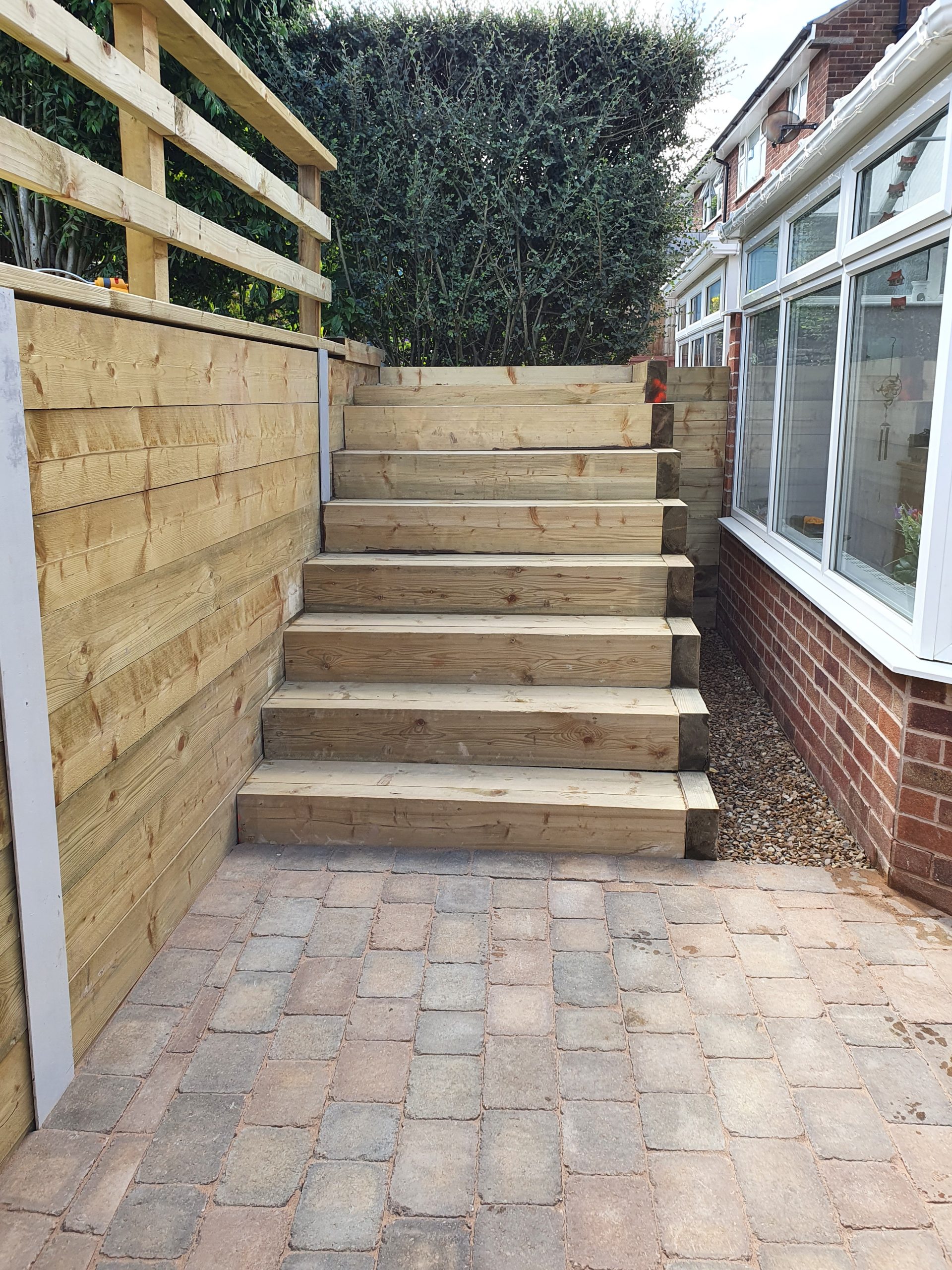 Wooden stairs to higher garden level
